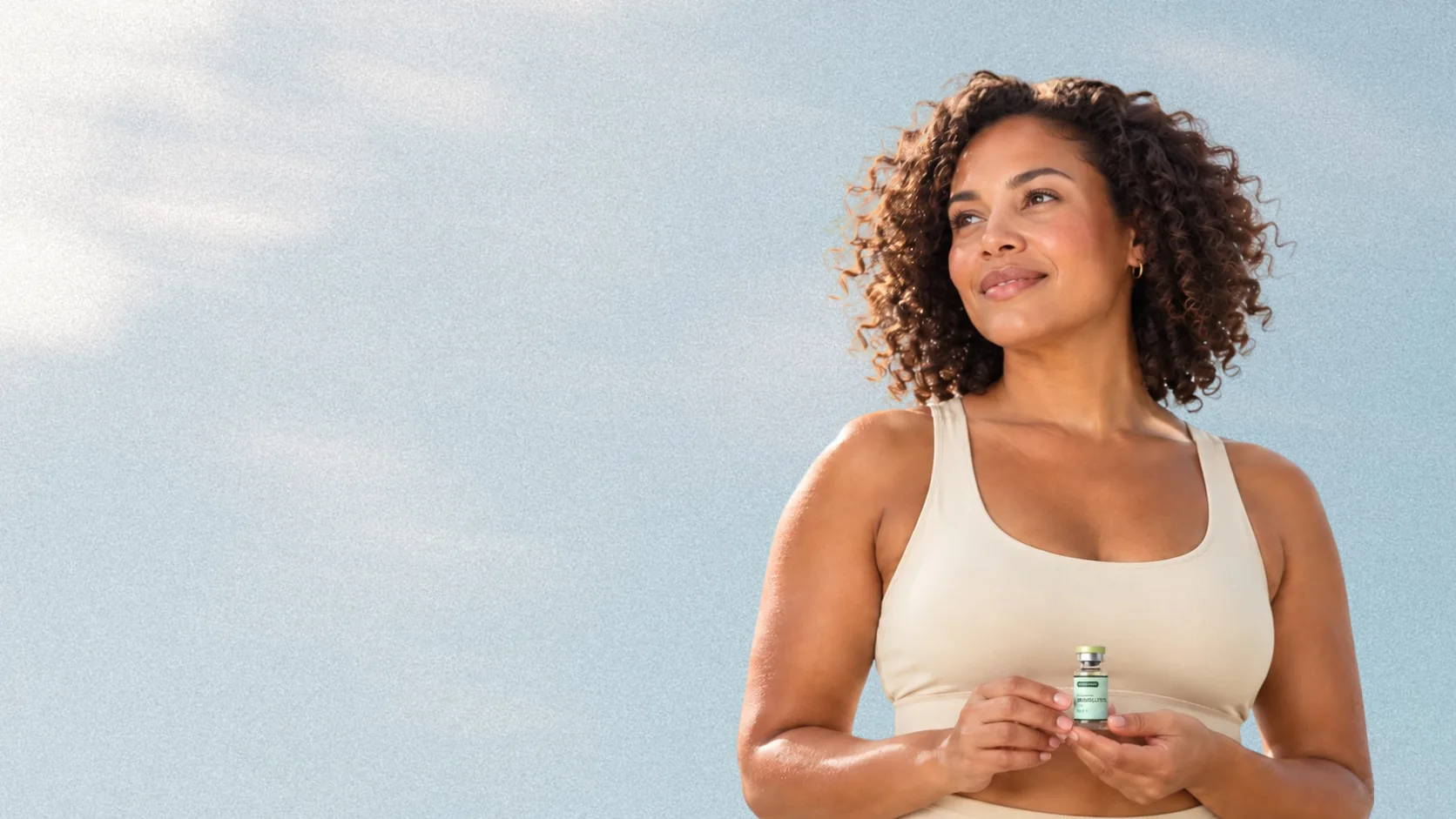 YourEra member holding her compounded semaglutide vial